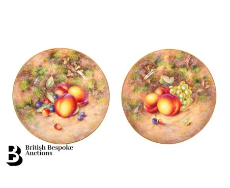 A pair of Royal Worcester Fallen Fruits cabinet plates. Each plate painted with autumnal fruits heightened with gilt rims, si