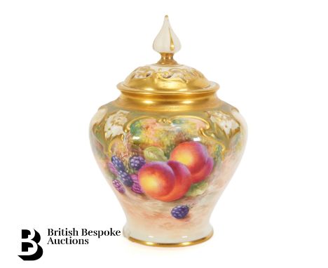 Royal Worcester Fallen Fruits vase and cover. The vase painted with autumnal fruits, heightened with gilt, signed Harry Ayrto