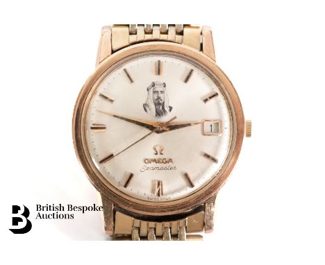 A circa 1964 Omega Seamaster wrist watch. The watch having an oyster coloured face with baton markers, featuring a portrait o
