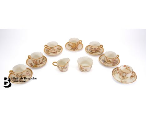 Royal Worcester part tea set, comprising six cups and saucers, the handle and rim heightened with gilt, a milk jug and sugar 