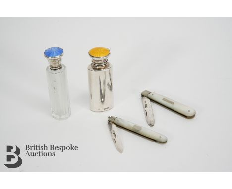 A silver and enamel topped scent bottle, with the original stopper, a silver topped and enamel scent bottle (af) together wit