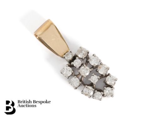 18ct yellow and white gold diamond pendant, set with approx 1.20 cts of dias, with a 14ct bail (tested). The pendant measures