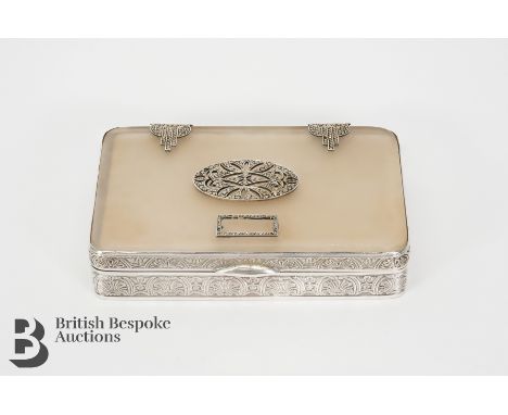 Art Deco silver compact. The mirrored compact having a composite top with inlaid marcasite decoration, engine turned and engr