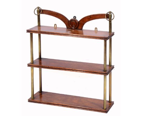 A THREE TIER MAHOGANY WALL SHELF with brass supports and shaped brackets, 61cm wide x 68cm high