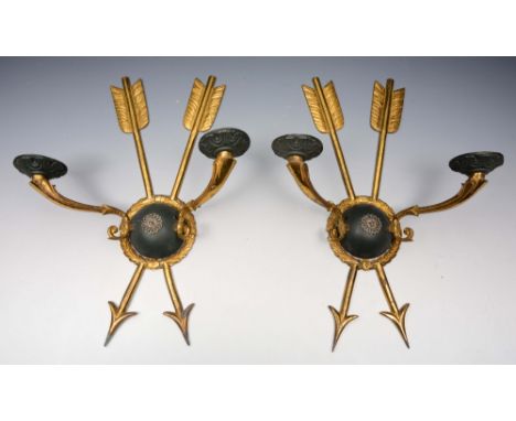 A PAIR OF GILT BRASS TWO BRANCH WALL LIGHTS of cross arrow, wreath and shield form, 31cm high (2)