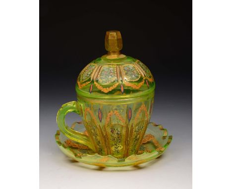 A BOHEMIAN GREEN GLASS SHERBERT CUP, COVER AND STAND with gilded and enamel decoration, 16cm high