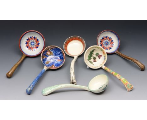A GROUP OF SIX 19TH CENTURY CERAMIC SAUCE LADLES, two creamware, four pearl ware