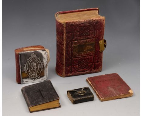 A KING GEORGE V COMMEMORATIVE CORONATION MINIATURE COMMON PRAYER BOOK, the silver mounted cover embossed with oval head and s