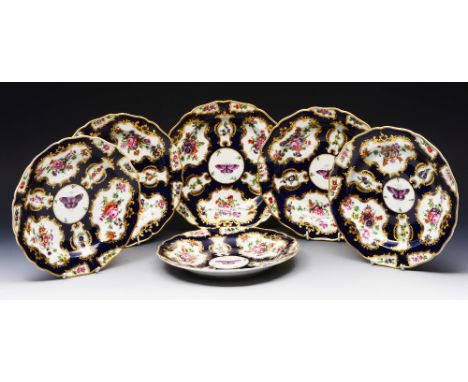 A SET OF SIX WORCESTER FIRST PERIOD STYLE BLUE GROUND PLATES decorated summer flowers and butterflies, 23cm diameter