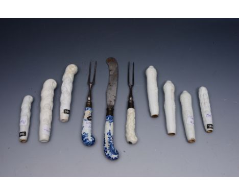 A COLLECTION OF SEVEN CHELSEA WHITE PORCELAIN CUTLERY HANDLES with trailing flower decoration, a steel two prong fork with a 