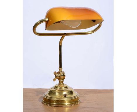 A BRASS STUDENTS LAMP with glass shade and circular base, 39cm high