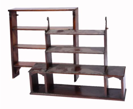A MAHOGANY FOUR TIER WALL SHELF with shaped brackets, 104cm wide; and another with plain column support, 87cm wide (2)