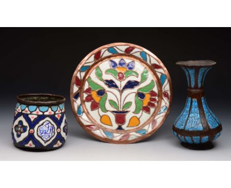 A GROUP OF THREE SYRIAN ENAMEL ITEMS TO INCLUDE a circular dish, 22cm diameter, a tapering bowl, 10cm high and a blue enamel 