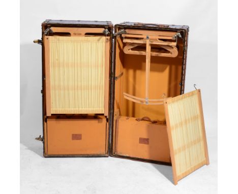 A LOUIS VUITTON CABIN TRUNK OR PORTABLE WARDROBE OR MALLE ARMOIRE, the interior fitted original stamped hangers, linen screen
