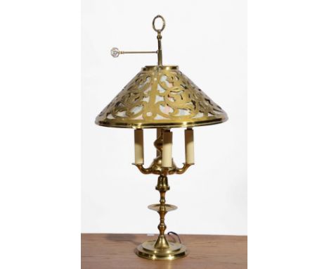 A BRASS FOUR BRANCH READING LAMP with pierced shade, wax tray and circular base, approximately 73cm high Purchased from Anno 