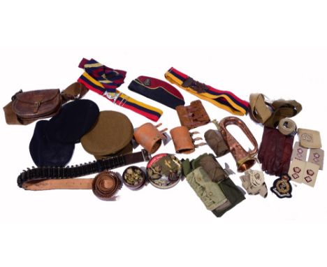 A COLLECTION OF MILITARY UNIFORM AND ACCESSORIES TO INCLUDE a collection of badges, a copper and brass bugle, leather belts, 