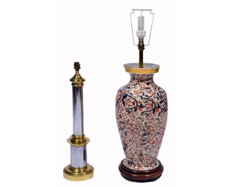 A JAPAN PATTERN PORCELAIN BALUSTER LAMP with wooden stand and brass fittings, 56cm high; together with a brass and steel cyli