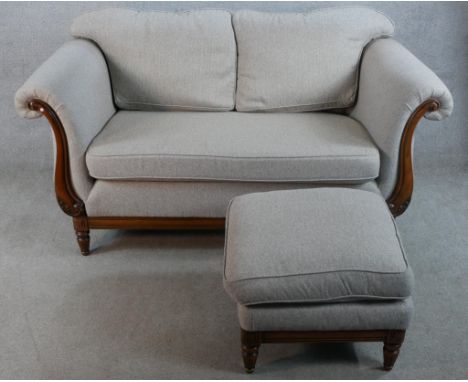 A 20th century mahogany framed two seater scroll arm settee upholstered in grey fabric raised on turned supports together wit