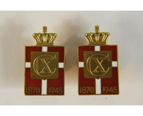 A pair of 14 carat gold and red and white enamel commemorative lapel badges by Georg Jensen for Danish King Christian  design