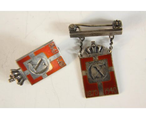 Two Georg Jensen silver and enamel commemorative badges, circa 1945 period in the form of a crowned shield bearing Danish fla