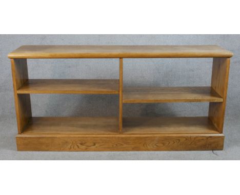 An early 20th century oak four shelf open bookcase raised on plinth base. H.71 W.147 D.33cm 