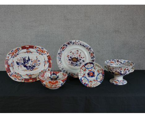 An early 20th century Masons Imari oval meat plate decorated with flowers, together with four other pieces of 19th century an