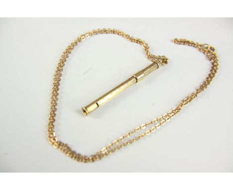 A 9ct gold engine turn decorated retractable toothpick and fine trace chain. Hallmarked: SJR for S J Rose &amp; Son, Birmingh