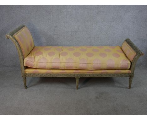 A 20th century Italian painted wooden framed daybed/child's bench with upholstered loose cushion raised on turned fluted supp