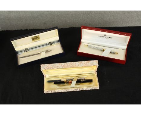 Three boxed pens to include two Caran d'Ache white metal rollerball pen and 20th century Pilot Japanese style fountain pen wi