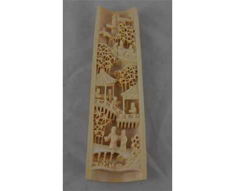 A Chinese carved ivory wrist rest, late Qing Dynasty / early&nbsp;republic, circa 1910-20, carved in high relief with seven s