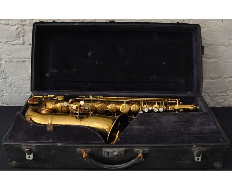 A vintage gilt/brass saxophone, bell engraved "Made by C G Conn Ltd 1914" and stamped "Sole English Agents, The Saxophone Sho