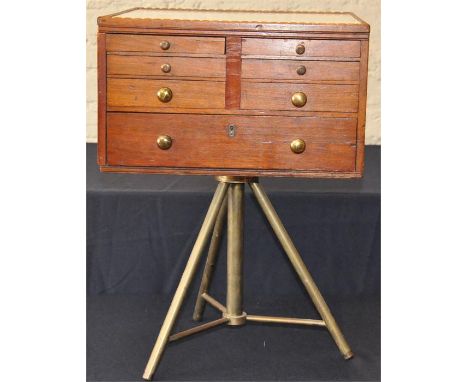 A&nbsp;walnut square dentist cabinet, early 20th century,&nbsp;the ceramic top over and arrangement of twelve opposing long a