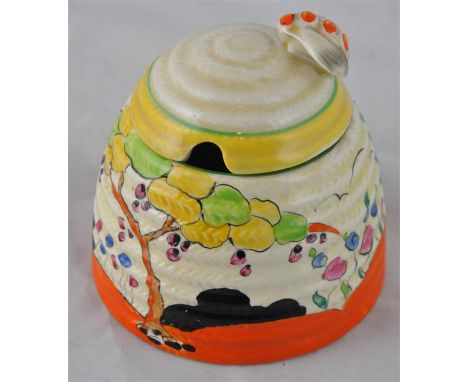 Clarice Cliff for Wilkinson, a Tulips beehive honey pot, Bizarre mark, 9cm high.&nbsp;CONDITION:spot staining and staining to