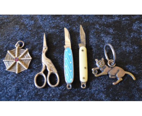 5 good luck charms including a turquoise enamel pen knife