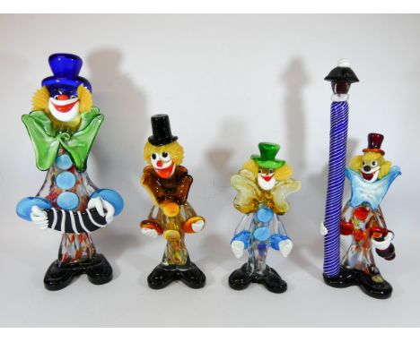 A collection of four Murano glass clowns to include a clown standing by a lamp post, tallest piece measures 33cm tall 