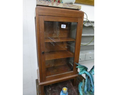 A small mahogany glazed display cabinet and a pale green painted wall shelf, fitted drawers 