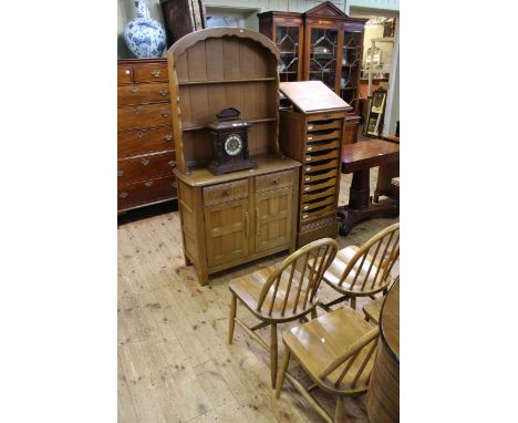 Set of four Ercol elm kitchen chairs together with an oak dome top dresser