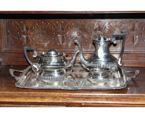 Four piece silver plated tea service with large engraved two handled tray