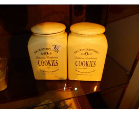 Pair of ceramic biscuit barrels advertising Mrs Winterbottoms.