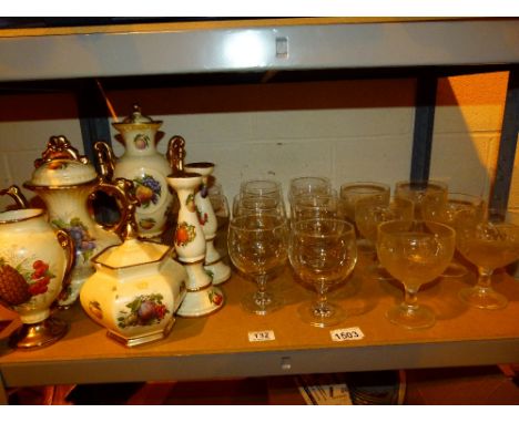 Quantity of ornate china depicting fruit, including candlesticks and teapot