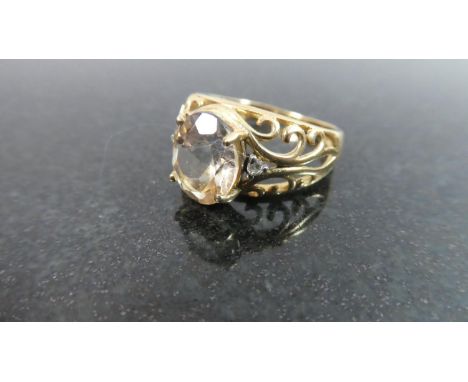 A 9ct Gold Dress Ring set with Diamond and Pale Sapphire, 3.5gms 