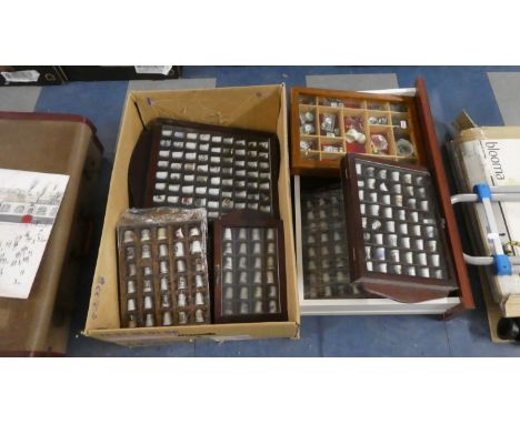A Large Collection of Souvenir Ceramic Thimbles in Display Cases 