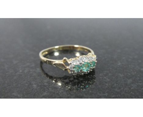 A 9ct Gold Dress Ring set with Diamonds and Emeralds 