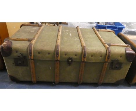 An Edwardian Canvas Wood and Leather Mounted Travelling Trunk, 95cms Wide 
