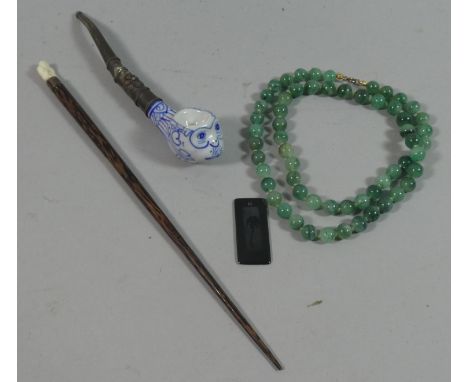 A Chinese Ceramic Pipe, Greenstone Necklace Etc 