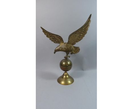 A Large Brass Study of Eagle Alighting on Globe, 49cms High 