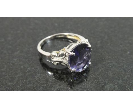 A 9ct White Gold Dress Ring Set with Diamonds and Tanzanite, 3.9gms 