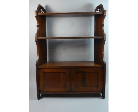 A Late Victorian Wall Hanging Mahogany Shelf Unit with Two Supports and Cupboard Base, 61cms Wide 