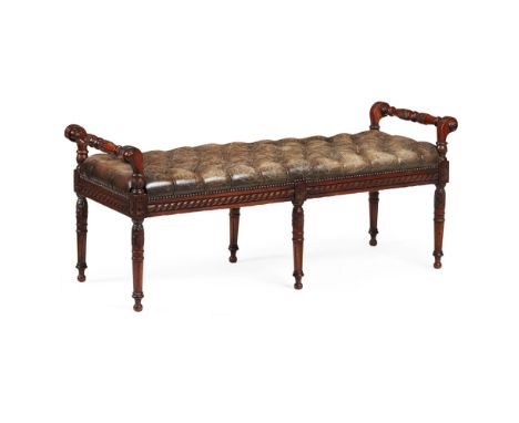 LEATHER UPHOLSTERED HALL BENCH  20TH CENTURY   the long button upholstered brown leather seat with foliate carved and turned 