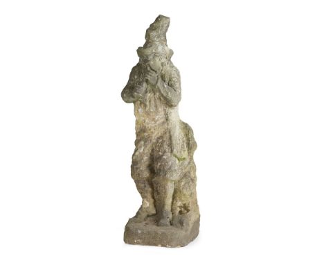 CARVED STONE FIGURE OF A HERMIT  18TH/ EARLY 19TH CENTURY   the bearded figure wearing a pointed hat, jacket and breeches, an